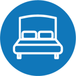 An icon of a bed in a blue circle.