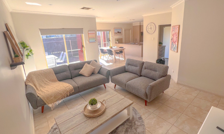 A SIL vacancy in a suburban living room with two couches and a coffee table - SIL vacancy in Brighton