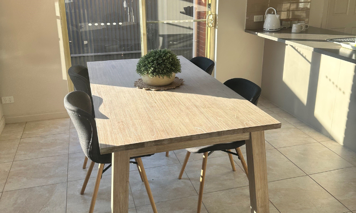 A wooden dining table in a suburban kitchen - SIL vacancy in Brighton