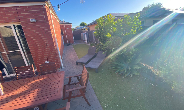 An aerial view of a suburban backyard with a table and chairs - SIL vacancy in Brighton