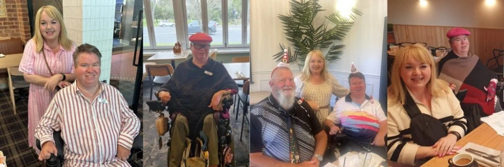 A group of people in various settings, some in wheelchairs, are posing together indoors. They are smiling and wearing casual attire, with some wearing hats.