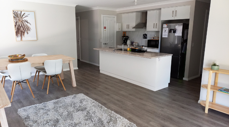 A kitchen and dining area in a small apartment.