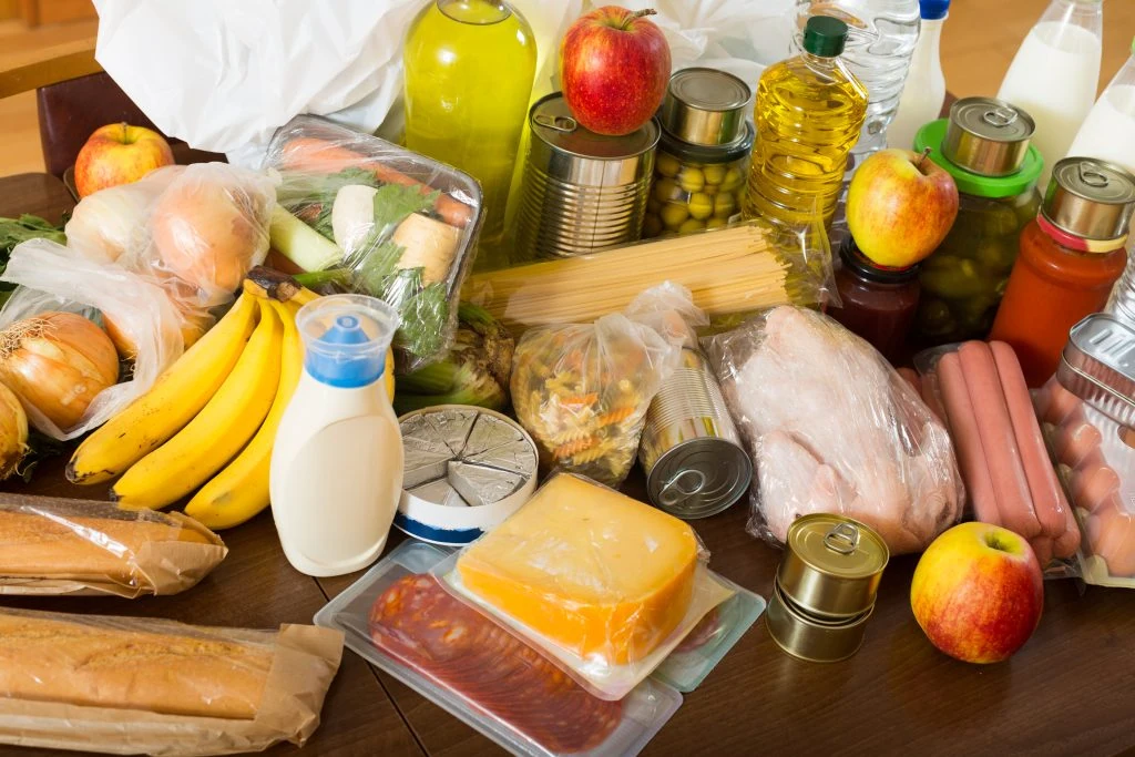 View at table with articles of food for family in home