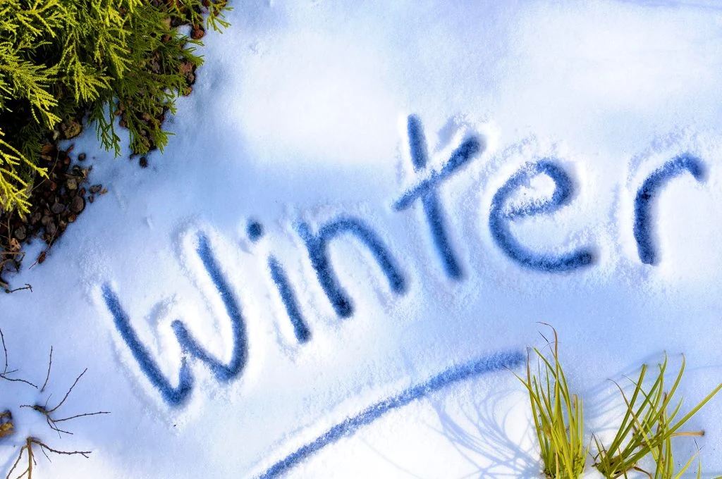 The word Winter written in fresh snow.