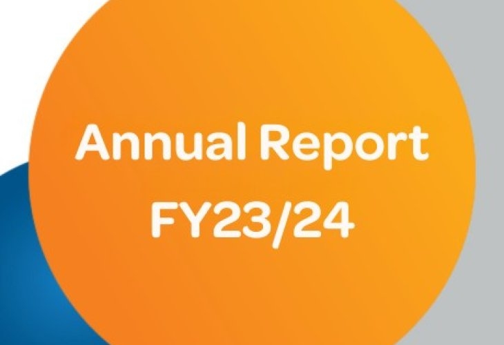 Orange circle with white text: "Annual Report FY23/24," against a gray and blue background.