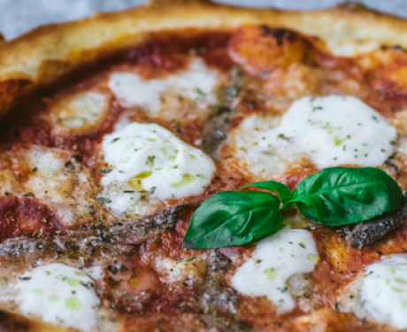 A flavorful and fresh pizza perfect for a quick lunch that combines mozzarella and basil toppings.