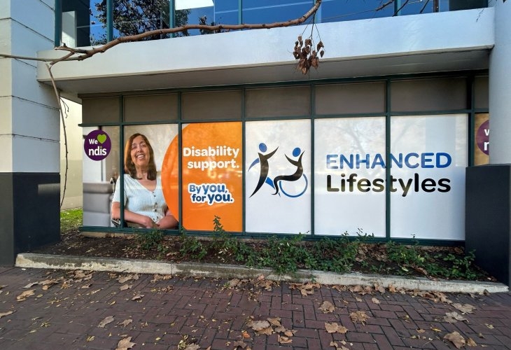 A building with a sign that says enhanced lifestyles.