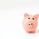 Small pink piggy bank centered on a plain white background.