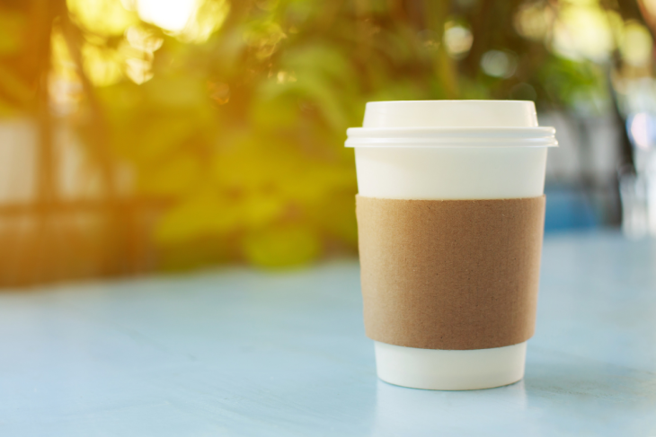 A cup of coffee sitting on a table.
